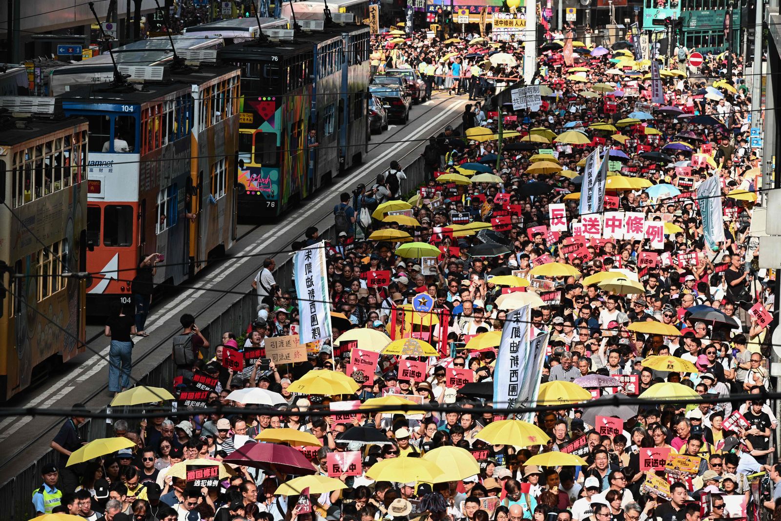 Activists attend a protest in Hong Kong on April 28, 2019, against a controversial move by the government to allow extraditions to the Chinese mainland. - Hong Kong's government has recently announced plans to overhaul its extradition rules, allowing the transfer of fugitives with Taiwan, Macau and mainland China on a 